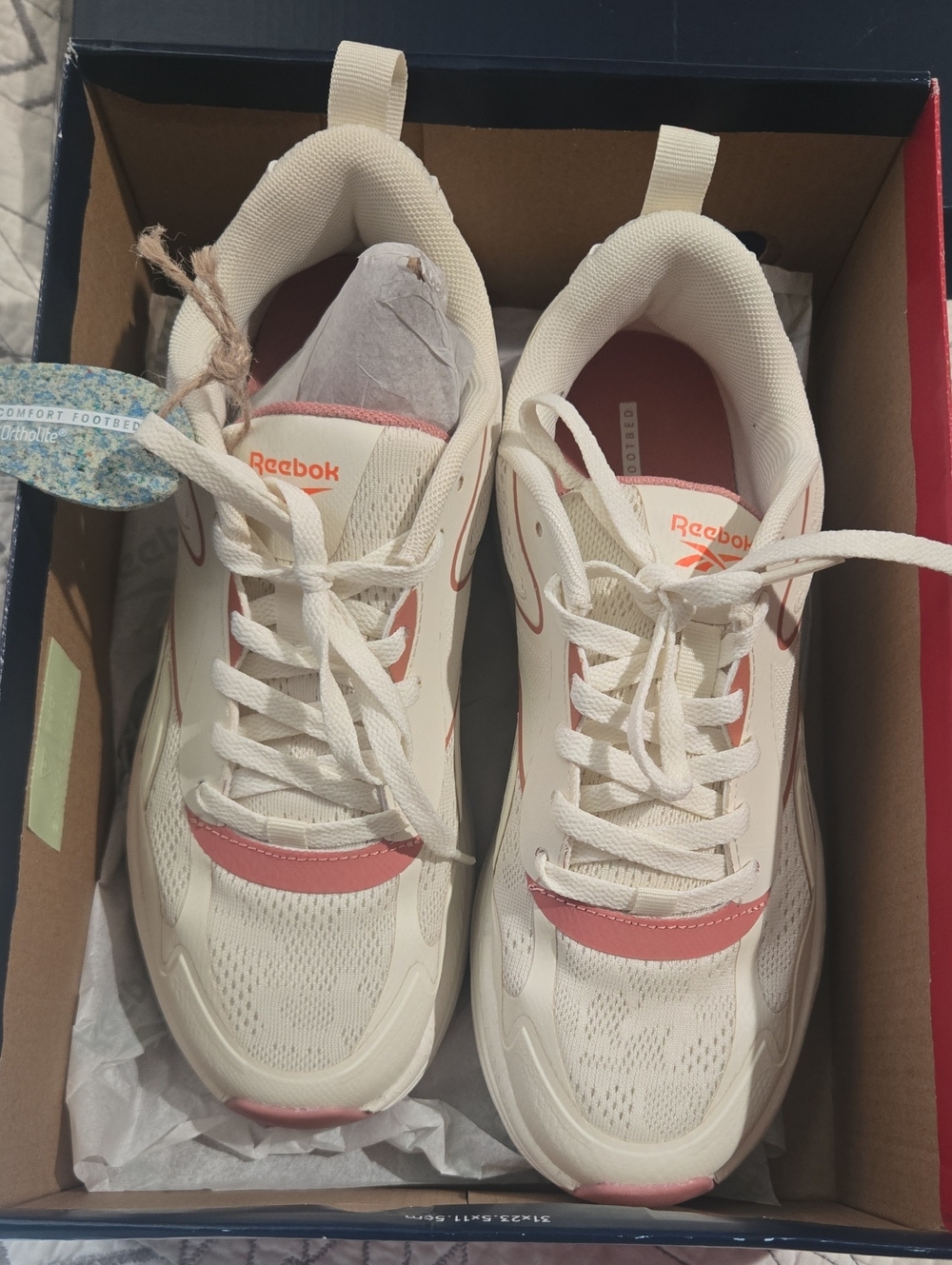Reebok Women's Cream Sneakers with Pink Accents